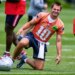 New England Patriots quarterback Drake Maye smiles during NFL football practice, Wednesday, May 27, 2026, in Foxborough, Mass.