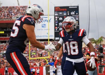 Kyle Williams celebrating with a teammate during a Patriots game against the Buccaneers.