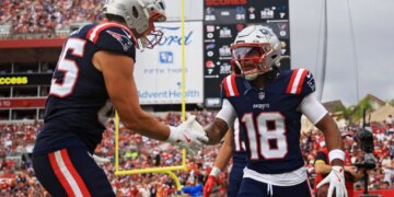 Kyle Williams celebrating with a teammate during a Patriots game against the Buccaneers.