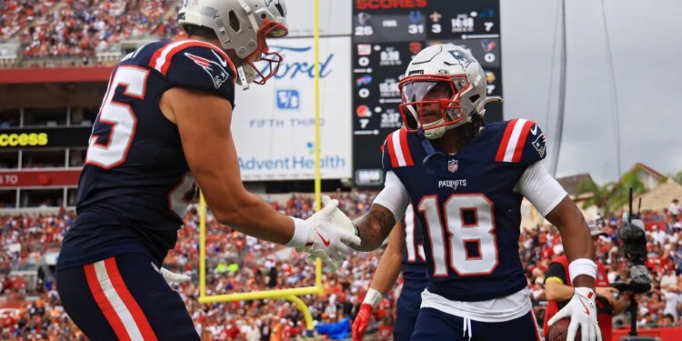 Kyle Williams celebrating with a teammate during a Patriots game against the Buccaneers.
