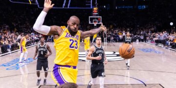 LeBron James of the Los Angeles Lakers slams the ball during the first half at Barclays Center, Tuesday, Feb. 3, 2026, in Brooklyn, NY.