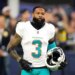 Odell Beckham Jr. with his helmet off, wearing a white Miami Dolphins jersey with the number 3.