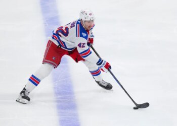 New York Rangers center Noah Laba skates with the puck.