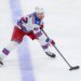 New York Rangers center Noah Laba skates with the puck.