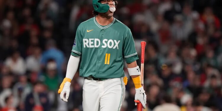 Boston Red Sox player Marcelo Mayer walks off the field after striking out.