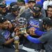 New York Knicks players celebrating with the Eastern Conference Champions trophy.