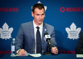 John Chayka, General Manager of the Toronto Maple Leafs, speaking at a press conference.