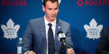 John Chayka, General Manager of the Toronto Maple Leafs, speaking at a press conference.