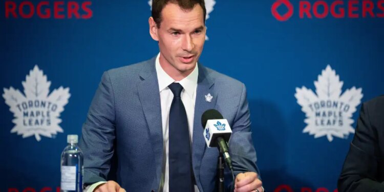John Chayka, General Manager of the Toronto Maple Leafs, speaking at a press conference.