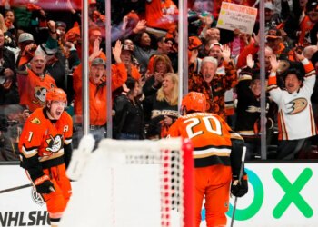 Ducks center Leo Carlsson (l.) celebrates his empty-net goal with Chris Kreider (20) during their Game 6 win over the Oilers on April 30, 2026.