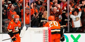 Ducks center Leo Carlsson (l.) celebrates his empty-net goal with Chris Kreider (20) during their Game 6 win over the Oilers on April 30, 2026.