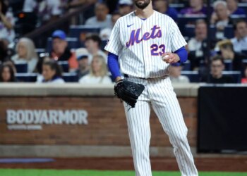 New York Mets pitcher David Peterson reacts after Cincinnati Reds left fielder JJ Bleday scores as the ball gets passes New York Mets catcher Luis Torrens in the sixth inning.