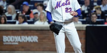 New York Mets pitcher David Peterson reacts after Cincinnati Reds left fielder JJ Bleday scores as the ball gets passes New York Mets catcher Luis Torrens in the sixth inning.
