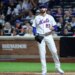 New York Mets pitcher David Peterson reacts after Cincinnati Reds left fielder JJ Bleday scores as the ball gets passes New York Mets catcher Luis Torrens in the sixth inning.