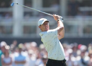 Rory McIlroy hits the ball on the 17th hole during the third round of the PGA Championship golf tournament.