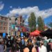 A crowd gathers to watch runners finish the Cocodona 250 ultramarathon in downtown Flagstaff, Arizona.
