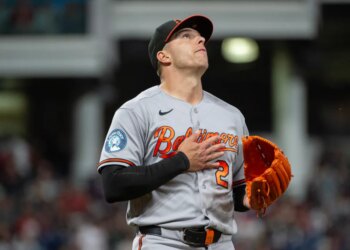 Baltimore Orioles relief pitcher Ryan Helsley reacts after the final out of a baseball game.