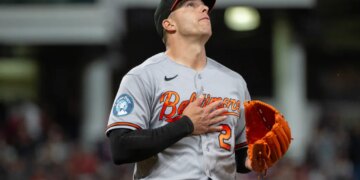 Baltimore Orioles relief pitcher Ryan Helsley reacts after the final out of a baseball game.