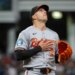 Baltimore Orioles relief pitcher Ryan Helsley reacts after the final out of a baseball game.
