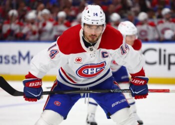 Montréal Canadiens center Nick Suzuki (14) lines up for a face-off during the second period in Game 1 of a second-round NHL hockey Stanley Cup playoff series against the Buffalo Sabres, Wednesday, May 6, 2026, in Buffalo, N.Y. (AP Photo/Jeffrey T. Barnes)