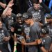 Victor Wembanyama, holding the Western Conference MVP trophy he won, celebrates with teammates after the Spurs' 111-103 Game 7 win over the Thunder on May 30, 2026 in Oklahoma City.