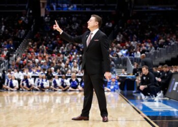 St. John's Red Storm head coach Rick Pitino reacts during a basketball game.
