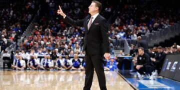 St. John's Red Storm head coach Rick Pitino reacts during a basketball game.
