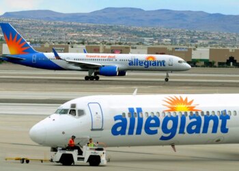 Two Allegiant Air jets taxi at McCarran International Airport in Las Vegas.
