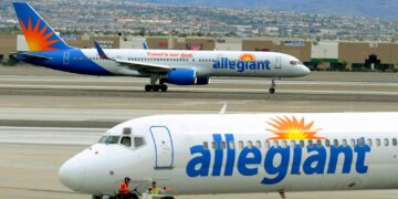 Two Allegiant Air jets taxi at McCarran International Airport in Las Vegas.