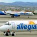 Two Allegiant Air jets taxi at McCarran International Airport in Las Vegas.