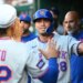 New York Mets left fielder Tyrone Taylor (28) is congratulated by teammates after scoring a run.