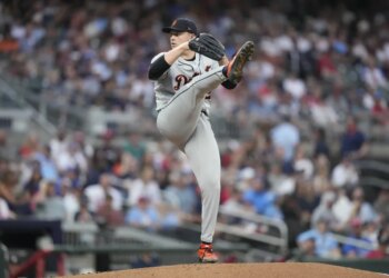 Detroit Tigers pitcher Tarik Skubal in mid-throw during a baseball game.