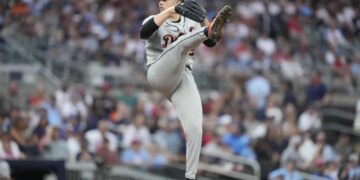 Detroit Tigers pitcher Tarik Skubal in mid-throw during a baseball game.