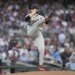 Detroit Tigers pitcher Tarik Skubal in mid-throw during a baseball game.
