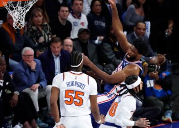 Philadelphia 76ers center Joel Embiid (R) is fouled by New York Knicks center Ariel Hukporti (L) in the first half during the Eastern Conference Semifinals, game one in the first quarter at Madison Square Garden in New York, New York, USA, Monday, May 04, 2026.