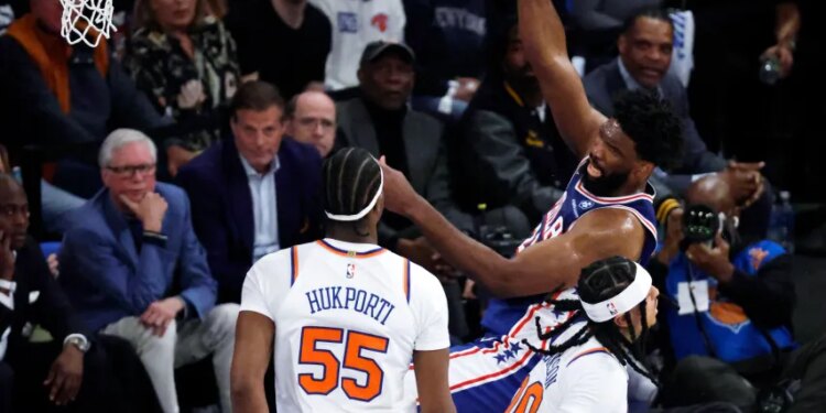 Philadelphia 76ers center Joel Embiid (R) is fouled by New York Knicks center Ariel Hukporti (L) in the first half during the Eastern Conference Semifinals, game one in the first quarter at Madison Square Garden in New York, New York, USA, Monday, May 04, 2026.