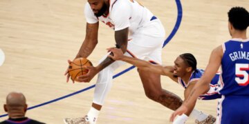 New York Knicks center Mitchell Robinson steals the ball from Philadelphia 76ers guard Tyrese Maxey (C) in the first half during the Eastern Conference Semifinals, game one in the first quarter at Madison Square Garden in New York, New York, USA, Monday, May 04, 2026