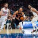 New York Knicks guard Jalen Brunson drives between Cleveland Cavaliers forward Dean Wade and center Jarrett Allen.