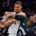 Spurs center Victor Wembanyama (1) commits a flagrant foul against Timberwolves center Naz Reid (11) during Game 4.
