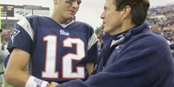 Tom Brady gets congratulated by Patriots coach Bill Belichick after beating the Indianapolis Colts 44-13 , Sunday, Sept. 30, 2001 in Foxboro, Mass.