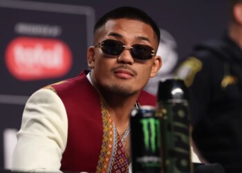 UFC fighter Roman Dolidze wearing sunglasses and a patterned vest.