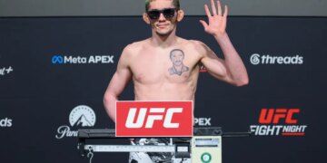 Melquizael Costa poses on the scale during the official weigh-in for UFC Fight Night.