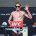 Melquizael Costa poses on the scale during the official weigh-in for UFC Fight Night.