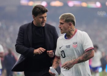 Soccer coach Mauricio Pochettino talking to midfielder Diego Luna during halftime.