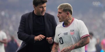 Soccer coach Mauricio Pochettino talking to midfielder Diego Luna during halftime.