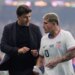 Soccer coach Mauricio Pochettino talking to midfielder Diego Luna during halftime.