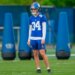 Dominic Zvada in New York Giants uniform #34 with a helmet on a practice field.