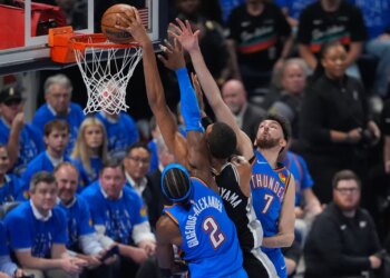 San Antonio Spurs forward Victor Wembanyama (1) shoots against Oklahoma City Thunder guard Shai Gilgeous-Alexander (2) and center Chet Holmgren (7) during the first half of Game 1 of the Western Conference finals.