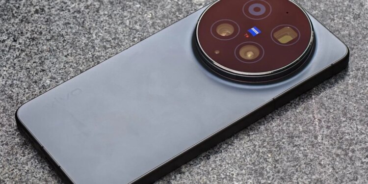 Photo of the Vivo X300 Ultra laying on a gray stone bench.