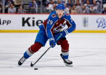 Apr 21, 2026; Denver, Colorado, USA; Colorado Avalanche center Nathan MacKinnon (29) controls the puck in the second period against the Los Angeles Kings in game two of the first round of the 2026 Stanley Cup Playoffs at Ball Arena. Mandatory Credit: Isaiah J. Downing-Imagn Images